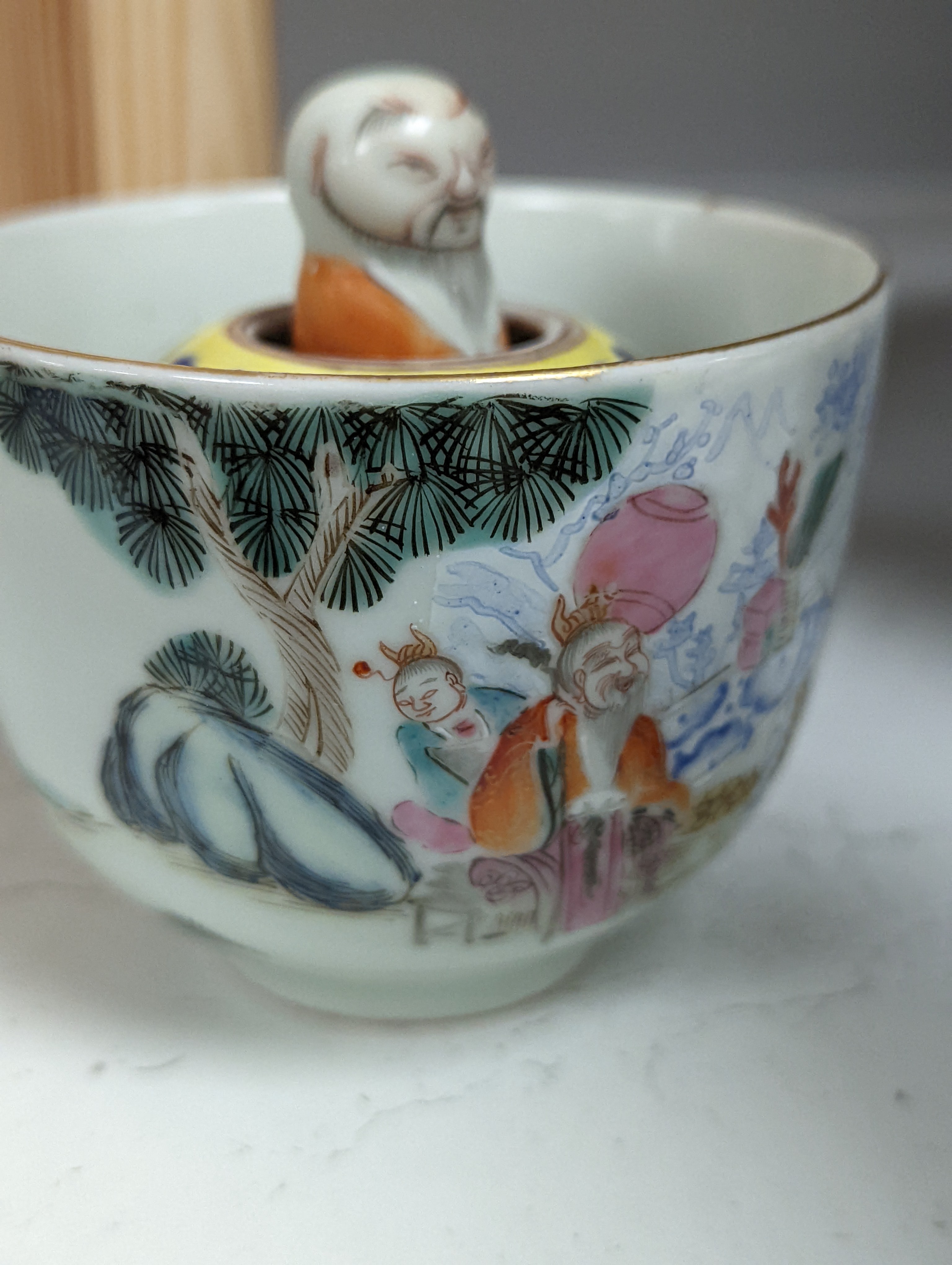 A Chinese famille rose puzzle cup, 8cm high
